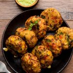 Crispy Corn Tikki, pakora or pakoda or pattice also known as cutlet. served with green chutney. Selective focus